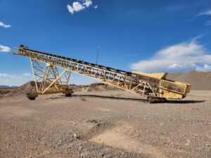 Radial Stacker - 24” wide x 100’ long Fixed Height Radial Conveyor